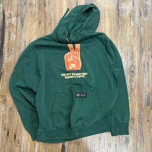 Nike Olive Hoodie with Orange Graphic